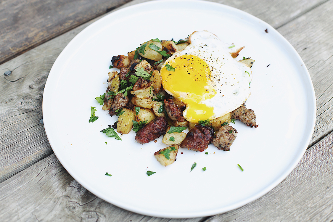 Plated sausage breakfast hash with egg