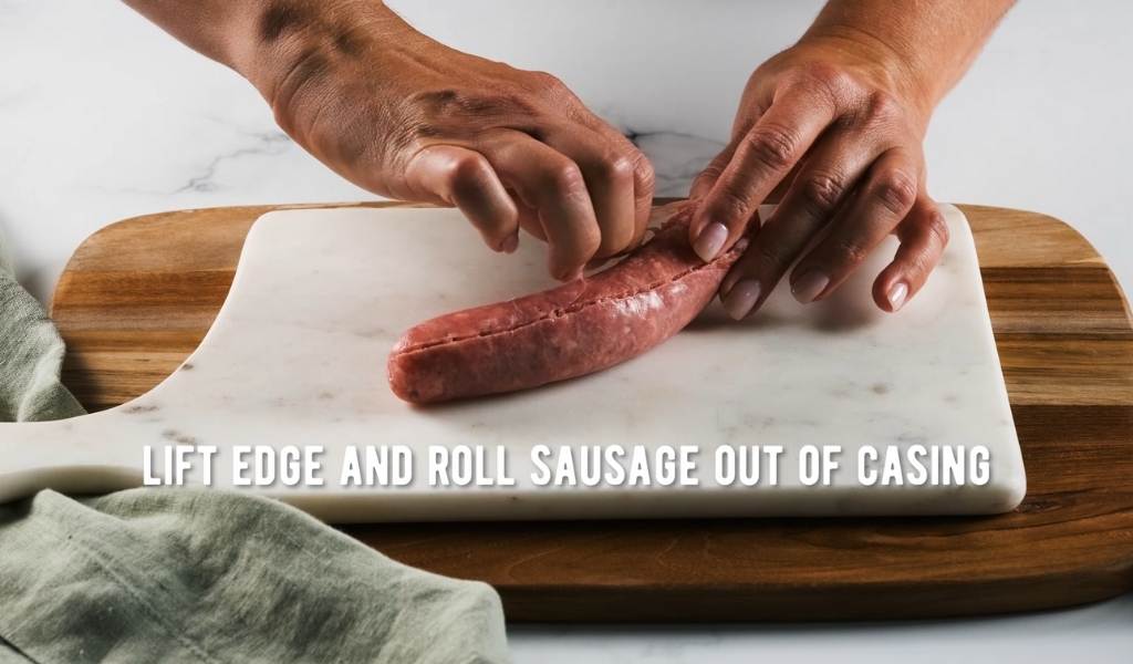 Step 2 to removing sausage casings - lift edge and roll sausage out of casing